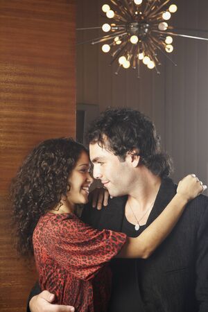 Hispanic couple hugging