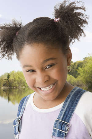 Close up of African American girl smilingの写真素材