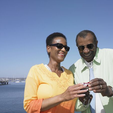 Senior African couple looking at camera