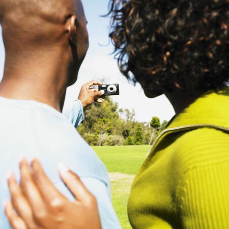 African couple taking own photographの写真素材