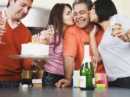 Middle-aged friends at birthday partyの写真素材