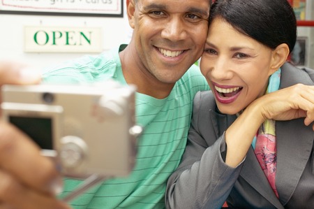 Couple smiling looking at camera