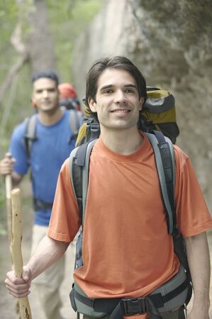 Two young men hiking in the forest