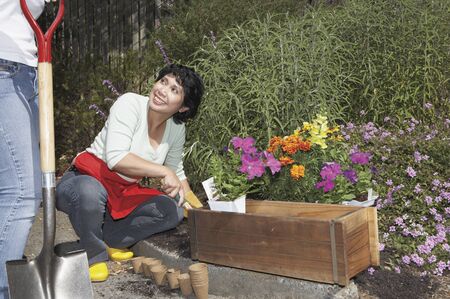 Middle aged woman gardening