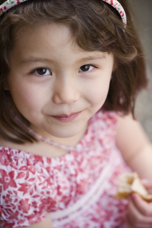 Close up portrait of girl eatingの写真素材