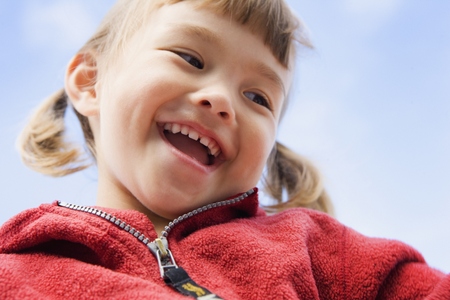 Close up portrait of young girl laughing