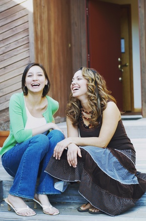 Young women laughing togetherの写真素材