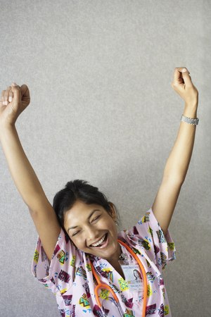 Indian female nurse yawning and stretchingの写真素材