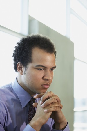African American businessman with hands foldedの写真素材