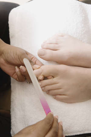 Close up of woman receiving pedicureの写真素材