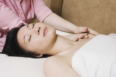 Asian woman receiving massageの写真素材