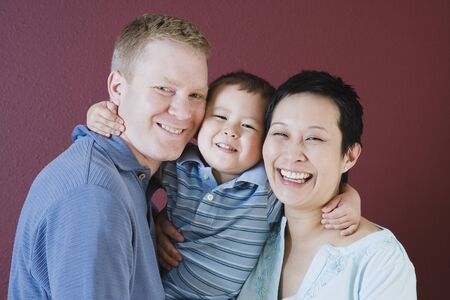 Studio shot of family with young son