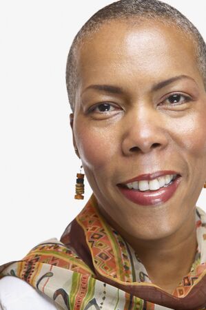 Studio shot of middle-aged African woman smilingの写真素材