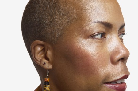 Close up studio shot of middle-aged African womanの写真素材