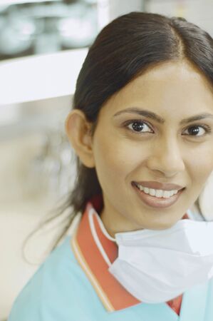 Close up of Indian female dental assistant smilingの写真素材