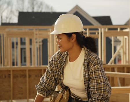 Asian female construction worker at construction siteの写真素材