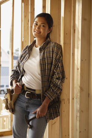 Asian female construction worker inside construction site