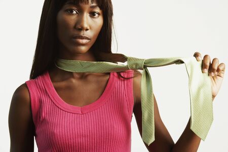 African woman wearing manÃ¢â¬â¢s necktieの写真素材