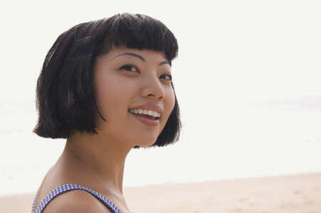 Close up of Asian woman at beachの写真素材