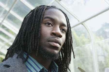 Close up of African man in greenhouseの写真素材