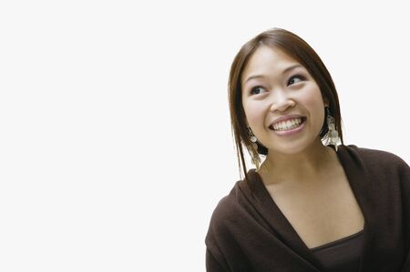 Studio shot of Asian woman smilingの写真素材