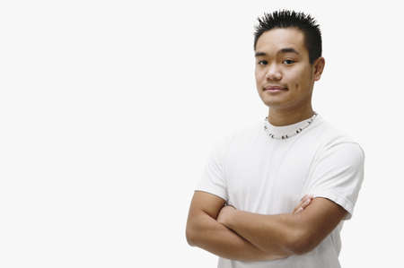 Portrait of Asian man with arms crossedの写真素材
