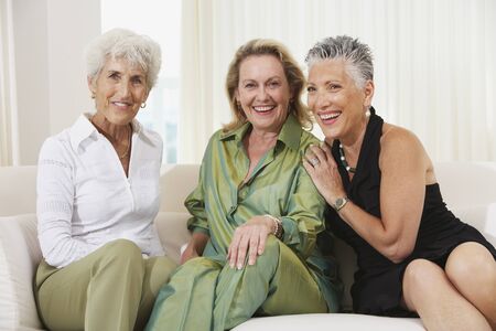 Three senior women sitting on sofaの写真素材
