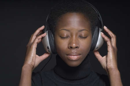 Portrait of African woman wearing headphonesの写真素材