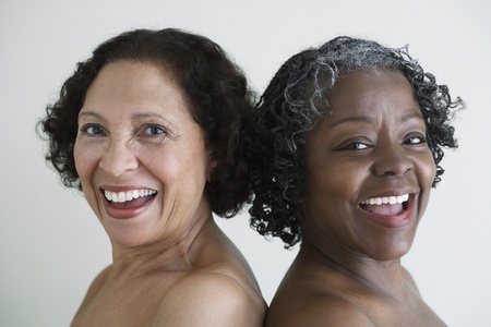 Two senior African women with bare shouldersの写真素材