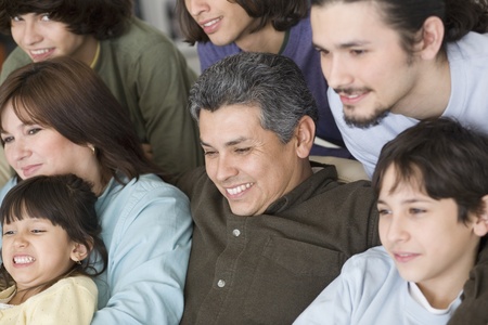 Portrait of Hispanic family on sofaの写真素材