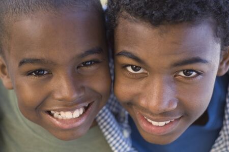 Close up of African brothers smilingの写真素材