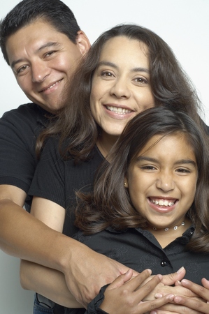 Hispanic family huggingの写真素材