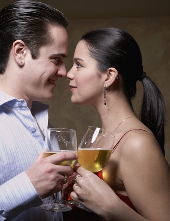 Multi-ethnic couple smiling at each otherの写真素材