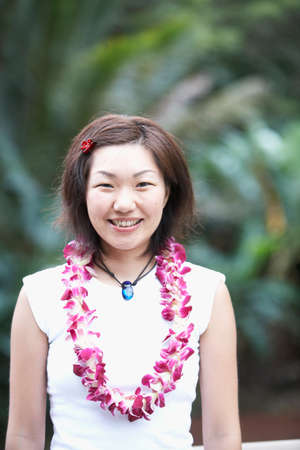 Asian woman wearing leiの写真素材