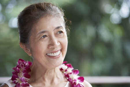Senior Asian woman wearing leiの写真素材