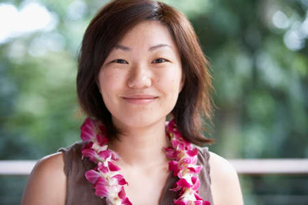 Asian woman wearing leiの写真素材