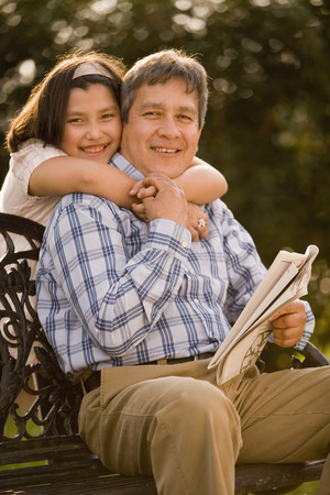 Hispanic girl hugging fatherの写真素材