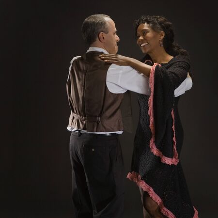 Multi-ethnic couple dancingの写真素材