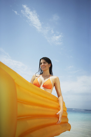 South American woman holding raftの写真素材