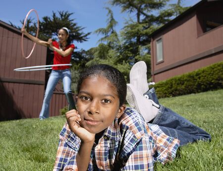 African boy laying in grass