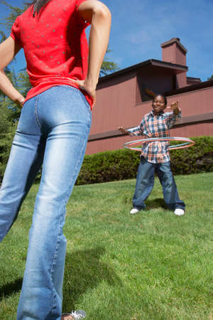 African boy playing with hula hoops