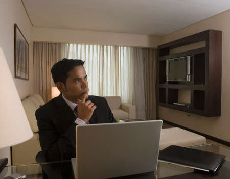 Hispanic businessman thinkingの写真素材