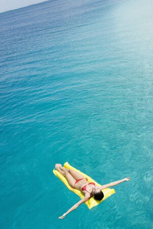 Woman on float in water