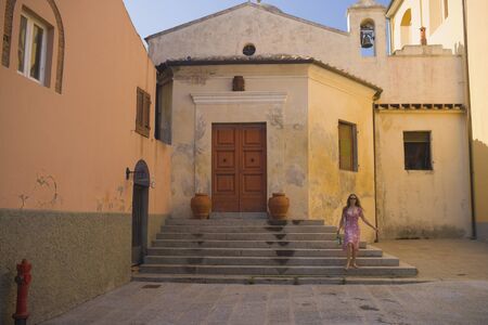 Hispanic woman at historic churchの写真素材