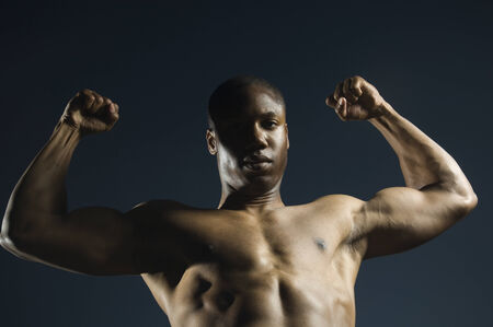 African American man flexing musclesの写真素材