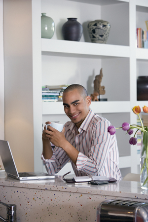 African American man holding coffee mugの写真素材