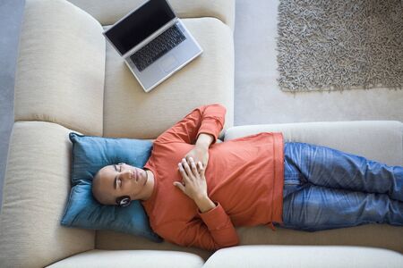 African American man listening to headphonesの写真素材
