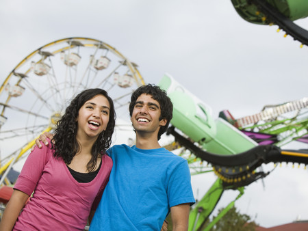 Multi-ethnic teenaged couple at carnivalの写真素材