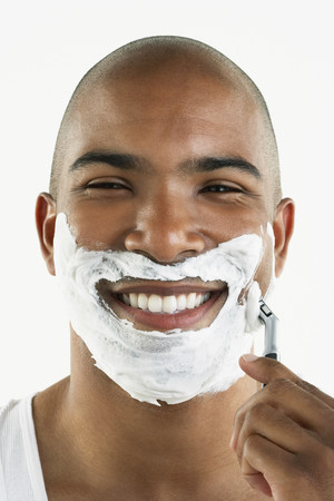 African man shaving faceの写真素材