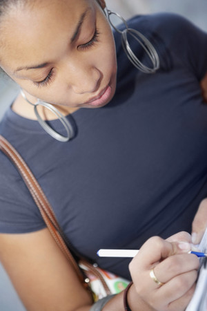 African woman writingの写真素材